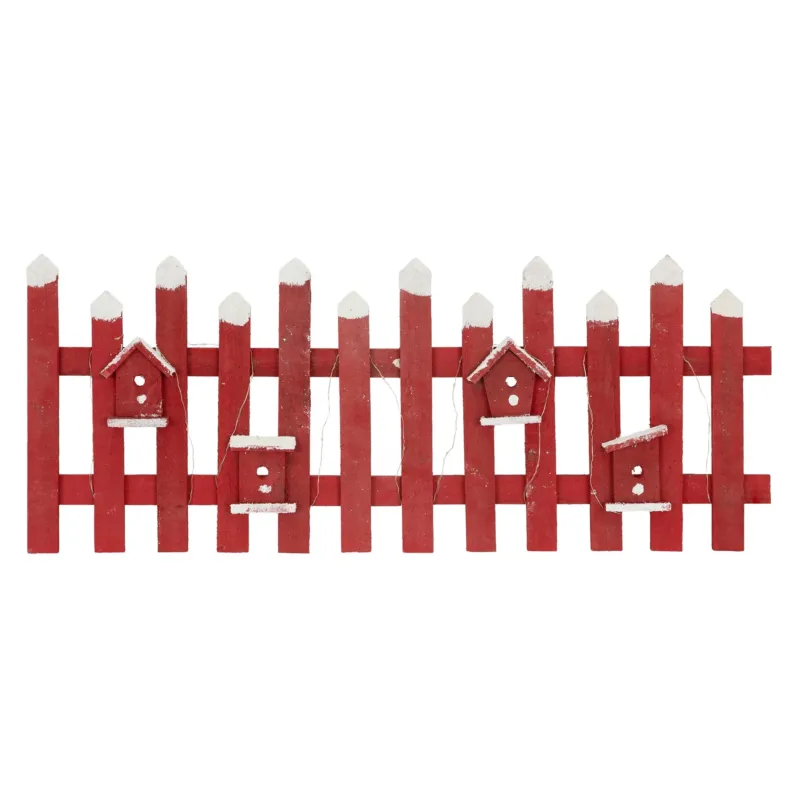 Rote Holzlattenzaun mit mehreren Vogelhäusern.